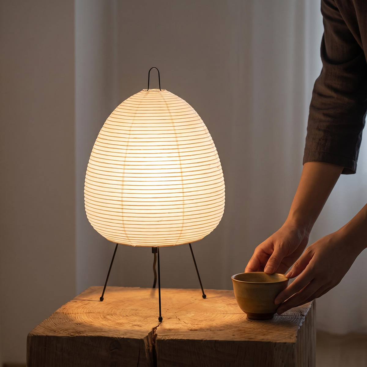 Japanese Rice Paper Table Lamp glowing on a side table