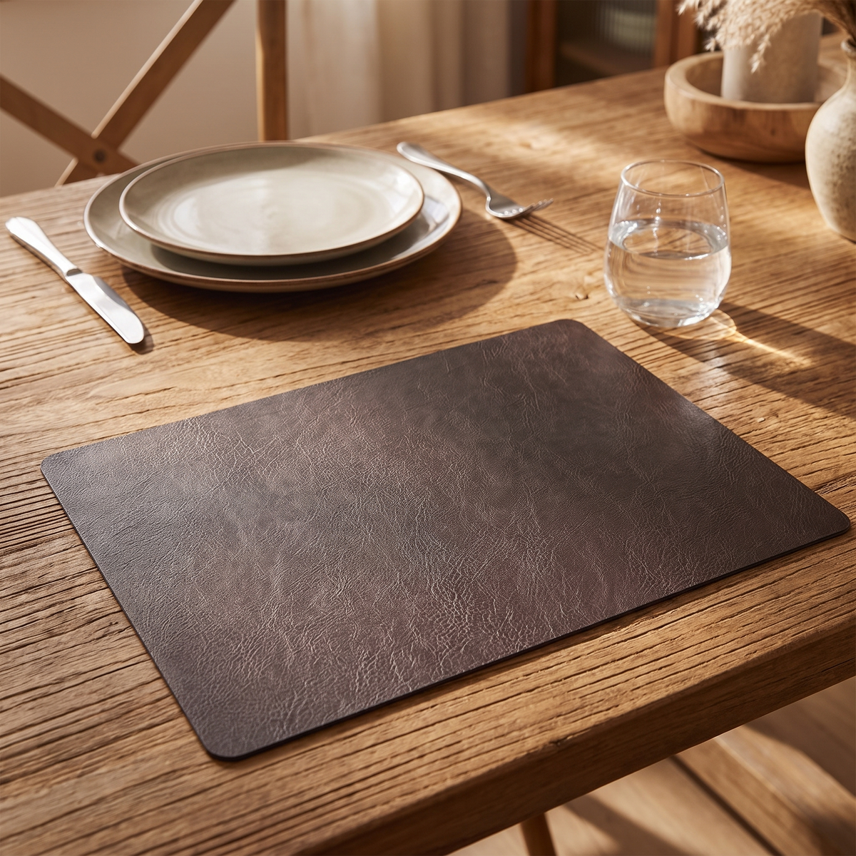 Double-Sided Faux Leather Placemat on a set dining table