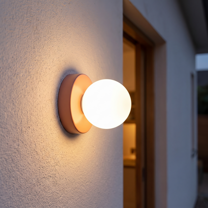 Macaron LED Wall Lamp with coloured glass shade lit in a hallway