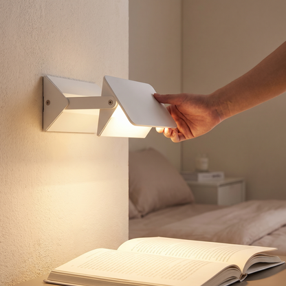 Modern LED Swing Wall Lamp being adjusted above a bed